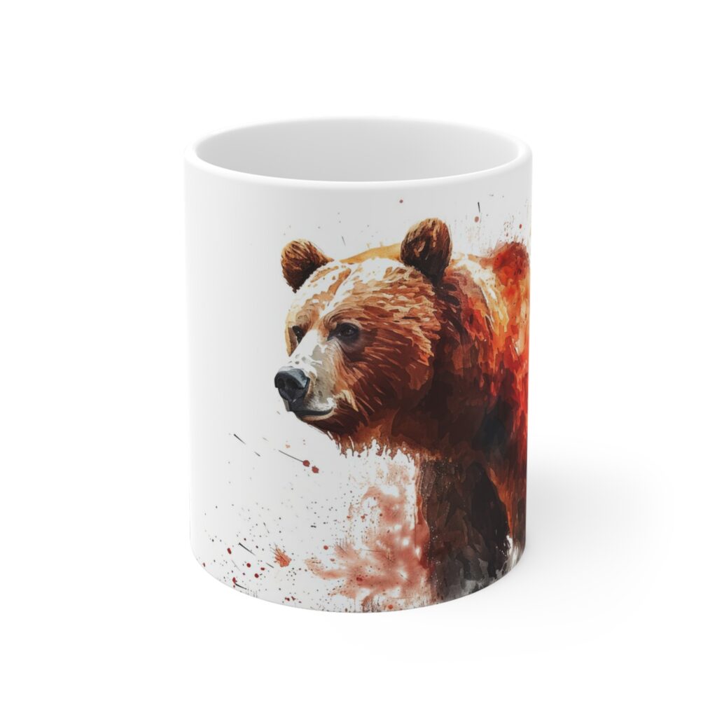 Ein Grizzlyb&auml;r in warmen Aquarellfarben ziert eine wei&szlig;e Keramiktasse mit markantem Wildtiermotiv.