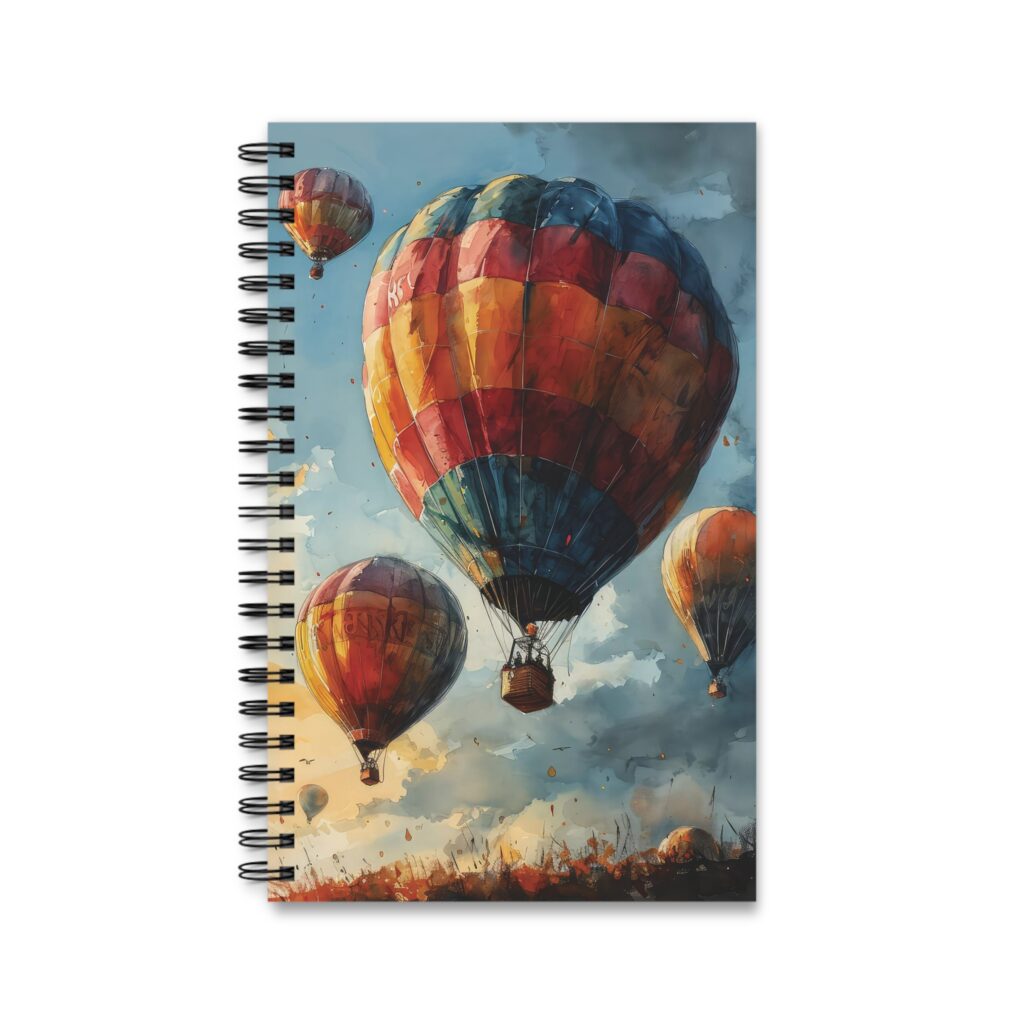 Das Notizbuch zeigt ein farbenfrohes Aquarell-Design mit mehreren Hei&szlig;luftballons und Ringbindung f&uuml;r kreatives Schreiben und Planen.