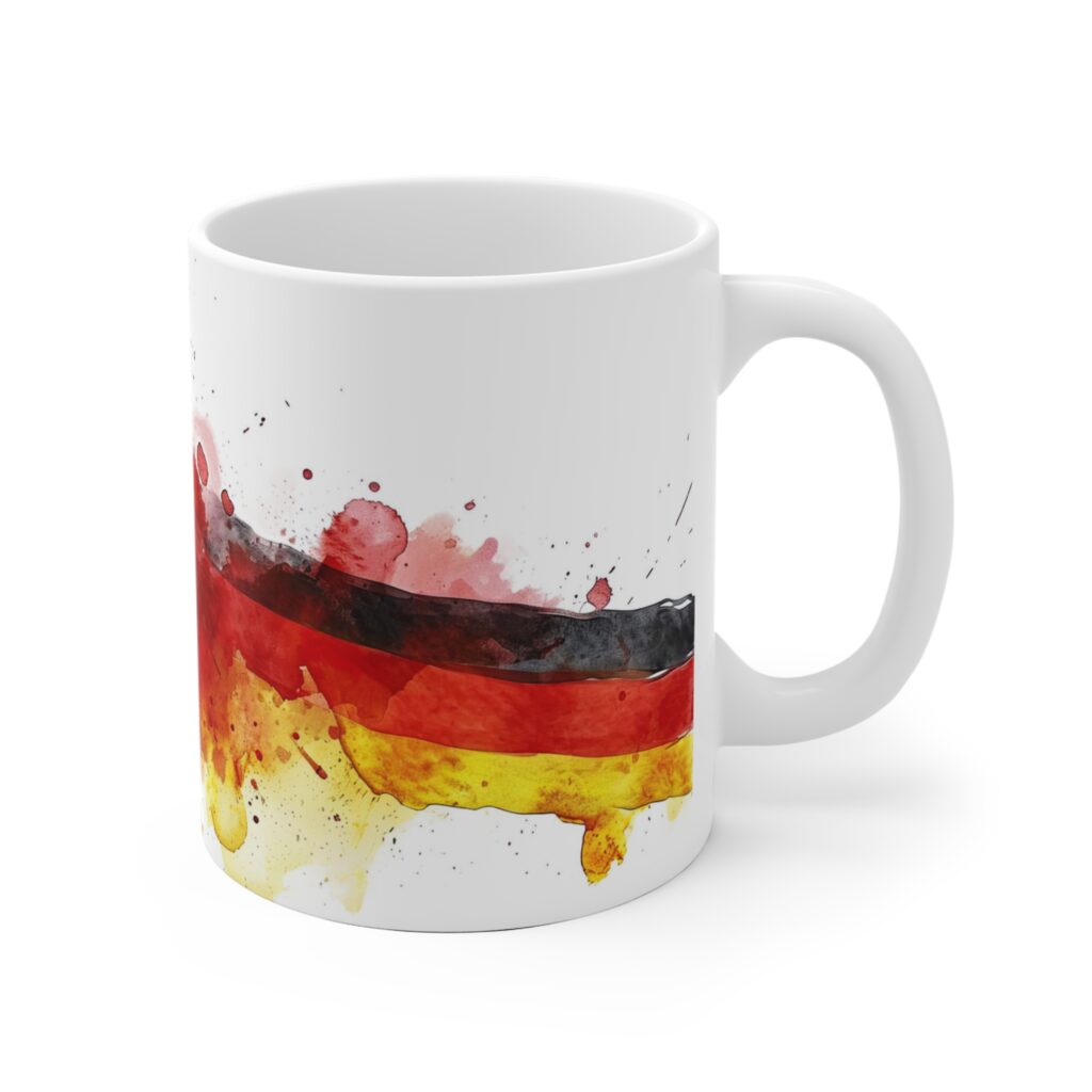 Mit Aquarellfarben in Rot, Schwarz und Gold setzt die Deutschlandflagge auf dieser Keramiktasse ein markantes Fanmotiv f&uuml;r Fu&szlig;ballfans und Patrioten.